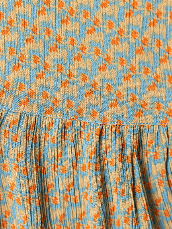 Blå blus i crepe viskos med sand och orange mönster fra Adia