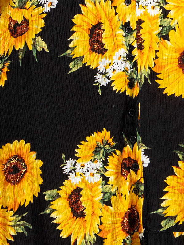 SIGNE - Svart klänning med stora gula solrosor fra Studio